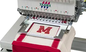 Cadre avec cerclage pneumatique automatique pour brodeuse industrielle